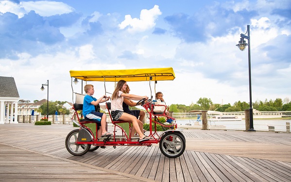 Young,Happy,Family,Riding,A,Double,Surrey,Tandem,Bicycle,On